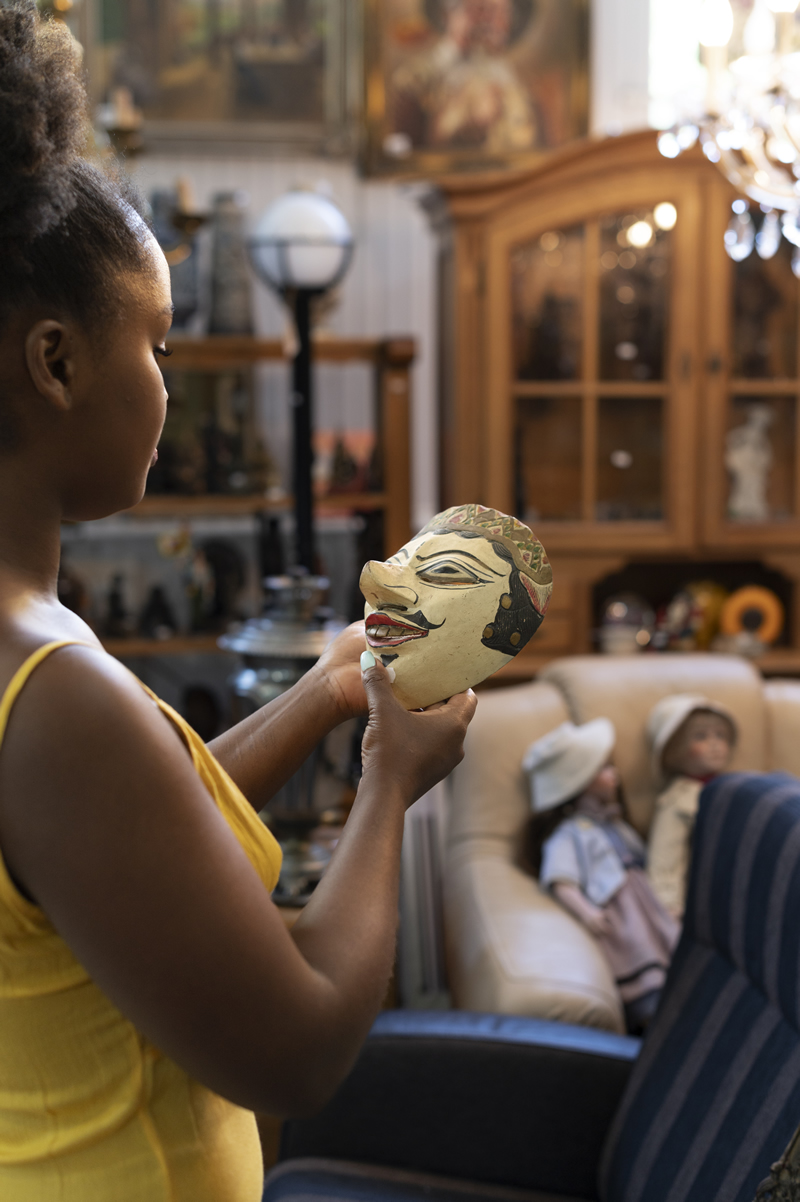 side-view-woman-holding-mask